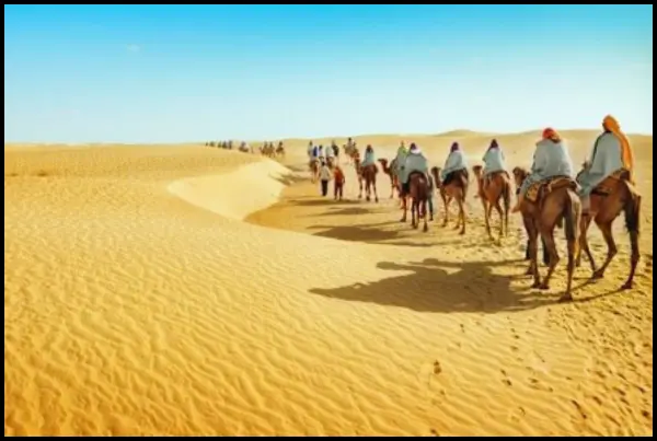 Some tourists visit Morocco's desert.